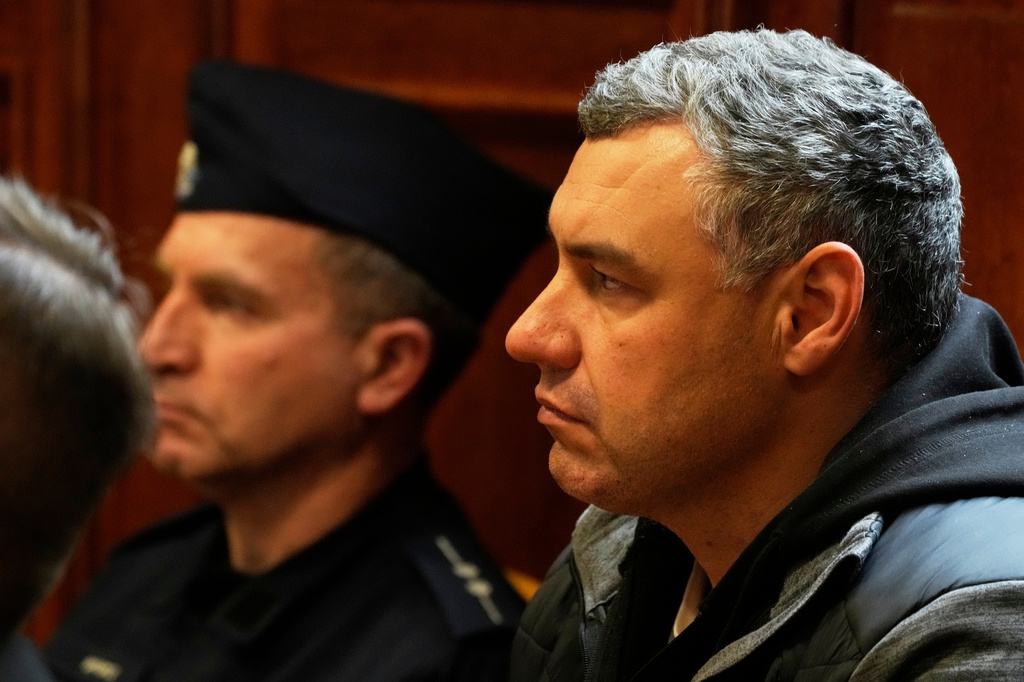 FILE - Ukrainian defendant Volodymyr Zhuravlov, right, listens as a judge announces the decision not to allow for extradition to Germany in courtroom of Warsaw's Regional Court in Warsaw, Poland, Friday, Oct. 17, 2025. (AP Photo/Czarek Sokolowski, File)