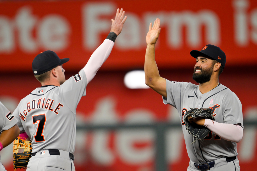 Detroit Tigers' Kevin McGonigle (7) and teammate Riley Greene, right, celebrate after their win against the Kansas City Royals during the ninth inning of a baseball game in Kansas City, Mo., Sunday, May 10, 2026. (AP Photo/Reed Hoffmann)