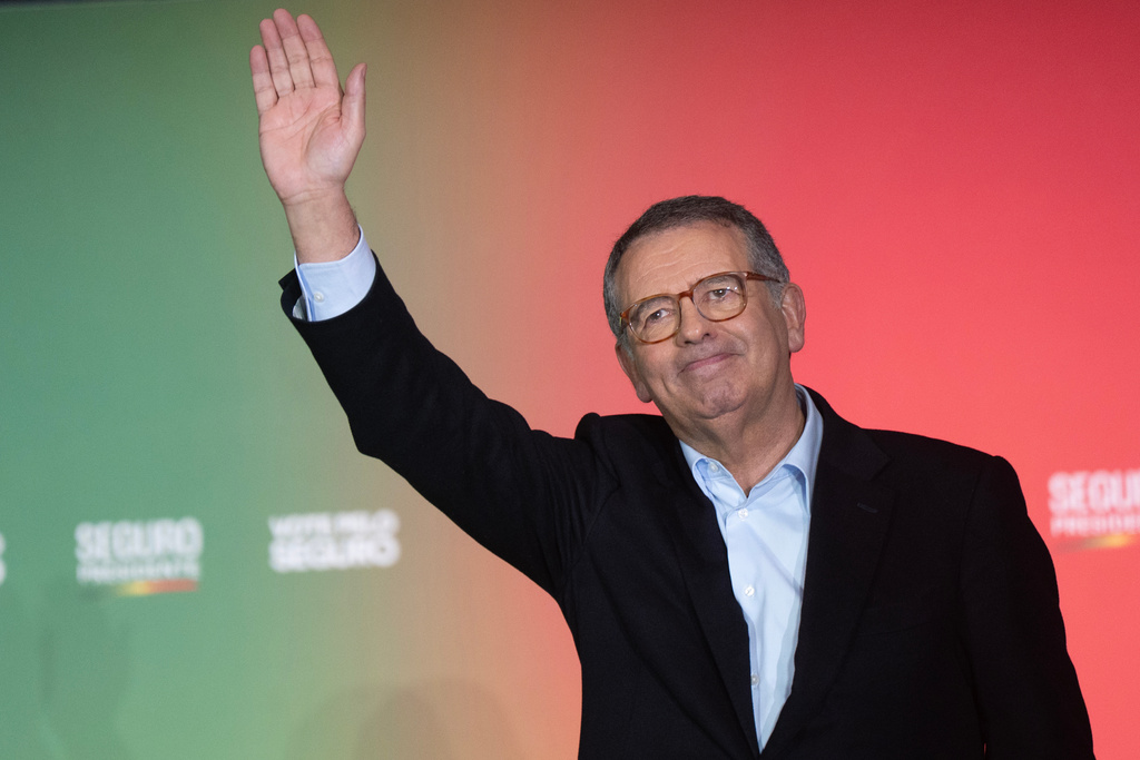 Presidential candidate Antonio Jose Seguro, of the center-left Socialist Party, waves to the crowd during a campaign rally ahead of the Feb. 8 presidential election in Lisbon, Thursday, Feb. 5, 2026. (AP Photo/Ana Brigida)