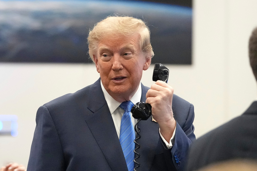 President Donald Trump speaks to astronauts aboard the International Space Station, Friday, Aug. 28, 2026, at Johnson Space Center's Mission Control Center in Houston. (AP Photo/Mark Schiefelbein)