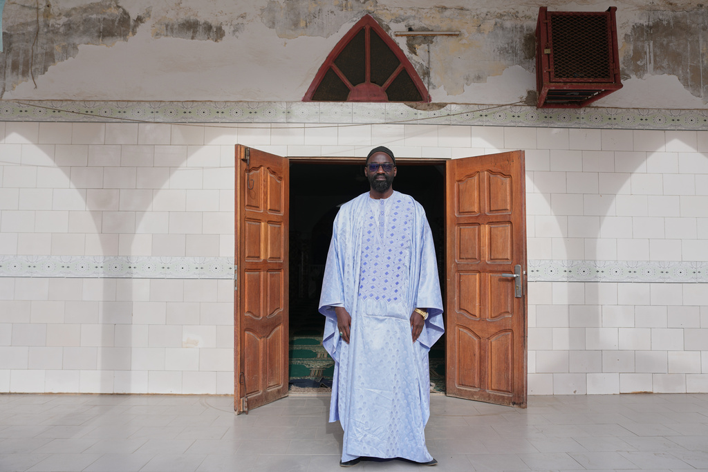 Ababacar Mboup, an activist against homosexuality and founder of And Samm Jikko Yi or "Together for the Preservation of Values," poses for a portrait in front of a mosque in Guediawaye, Senegal, Sunday, March 8, 2026. (AP Photo/Misper Apawu)