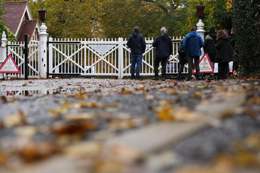 Journalists wait at an entrance near to the Royal Lodge, following the announcement that Prince Andrew will be stripped of his titles and leave the 30-room mansion he has occupied for more than 20 years in Windsor, England, Friday, Oct. 31, 2025.(AP Photo/Alastair Grant) Journalists wait at an entrance near to the Royal Lodge, following the announcement that Prince Andrew will be stripped of his titles and leave the 30-room mansion he has occupied for more than 20 years in Windsor, England, Friday, Oct. 31, 2025.(AP Photo/Alastair Grant)