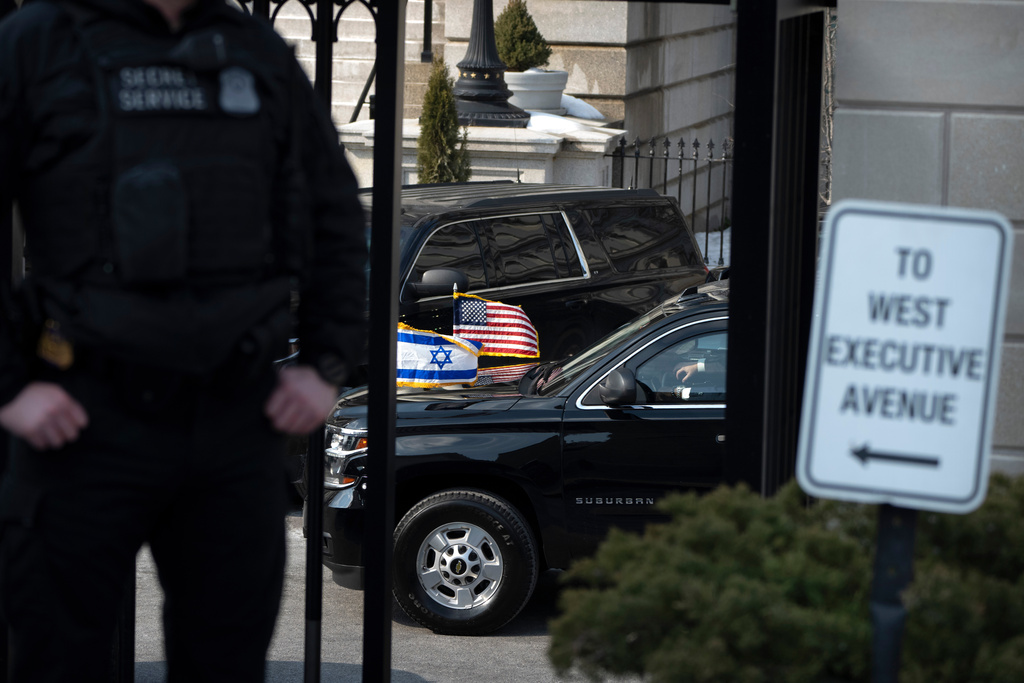 A vehicle carrying Israeli Prime Minister Benjamin Netanyahu arrives at the White House Wednesday, Feb. 11, 2026, in Washington. (AP Photo/Mark Schiefelbein)