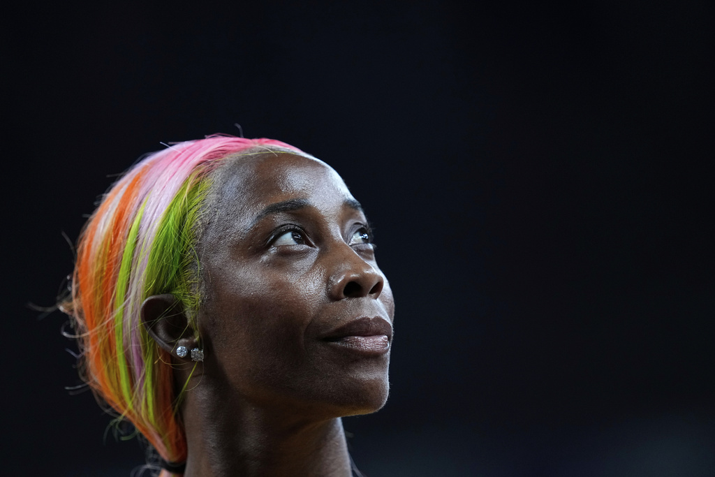 Jamaica's Shelly-Ann Fraser-Pryce looks up after finishing a women's 100 meters heat at the World Athletics Championships in Tokyo, Saturday, Sept. 13, 2025. (AP Photo/Petr David Josek)