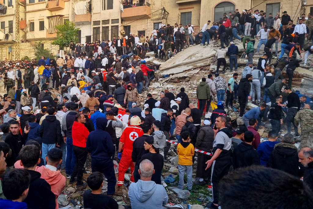 Rescue workers and residents search for survivors in the rubble of a building that collapsed in the northern city of Tripoli, Lebanon, Sunday, Feb. 8, 2026. (AP Photo)