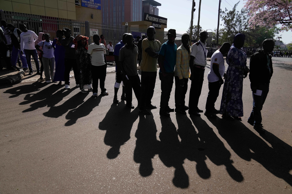 Voters line up to cast their ballots during the presidential election at a polling station in the capital, Kampala, Uganda, Thursday, Jan. 15, 2026. (AP Photo/Brian Inganga)