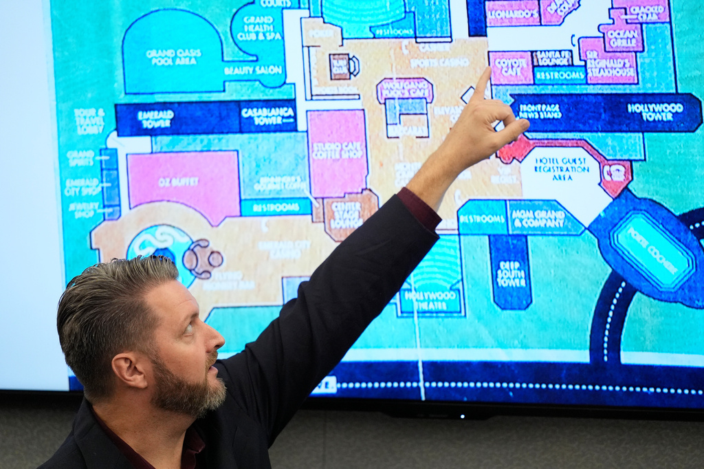 Michael Ingram, investigator for MGM Resorts, points to a map of the MGM Grand casino as he testifies during the murder trial of Duane "Keffe D" Davis related to the 1996 killing of rapper Tupac Shakur, at Clark County District Court Regional Justice Center in Las Vegas, on Tuesday, Aug. 18, 2026. (AP Photo/John Locher, Pool)