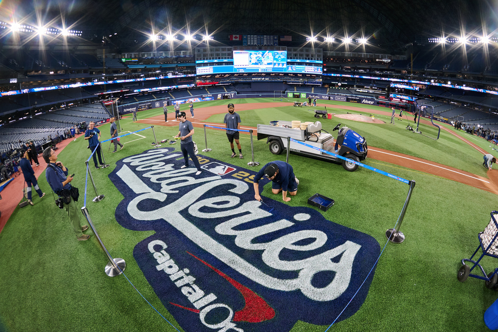 The World Series logo is painted on the field at Rogers Centre ahead of the 2025 World Series between the Toronto Blue Jays and the Los Angeles Dodgers in Toronto, on Thursday, Oct. 23, 2025. (Sammy Kogan/The Canadian Press via AP)