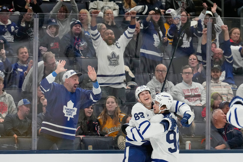 Toronto Maple Leafs defenseman Marshall Rifai (83) celebrates his goal with left wing Gavin McKenna (92) in the third period of an NHL hockey game against the Columbus Blue Jackets in Columbus, Ohio, Tuesday, October. 20, 2026. (AP Photo/Sue Ogrocki)
