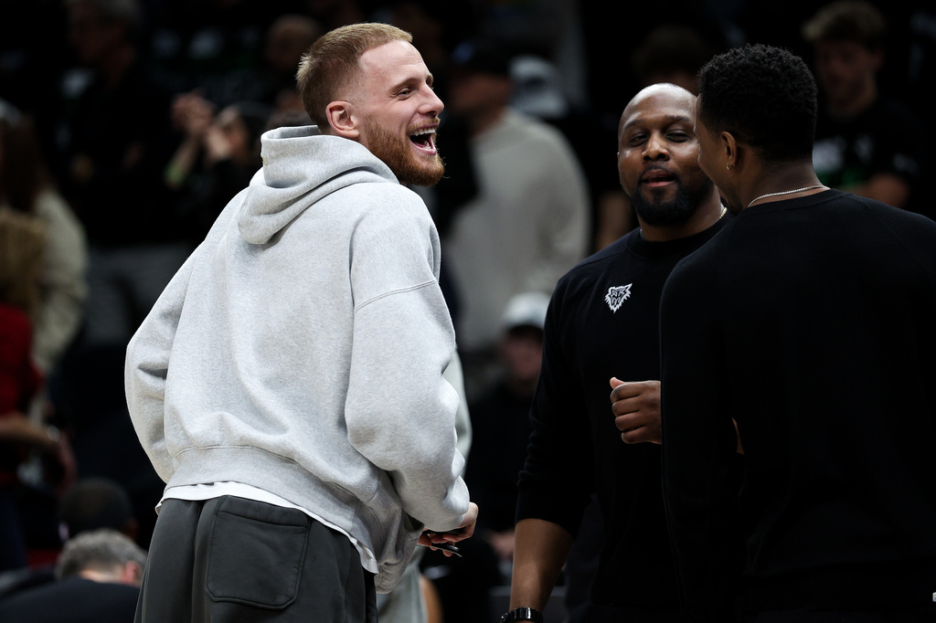 Minnesota Timberwolves guard Donte DiVincenzo, left, looks on during the second half of Game 6 of a first-round NBA basketball playoffs series against the Denver Nuggets, Thursday, April 30, 2026, in Minneapolis. (AP Photo/Matt Krohn)