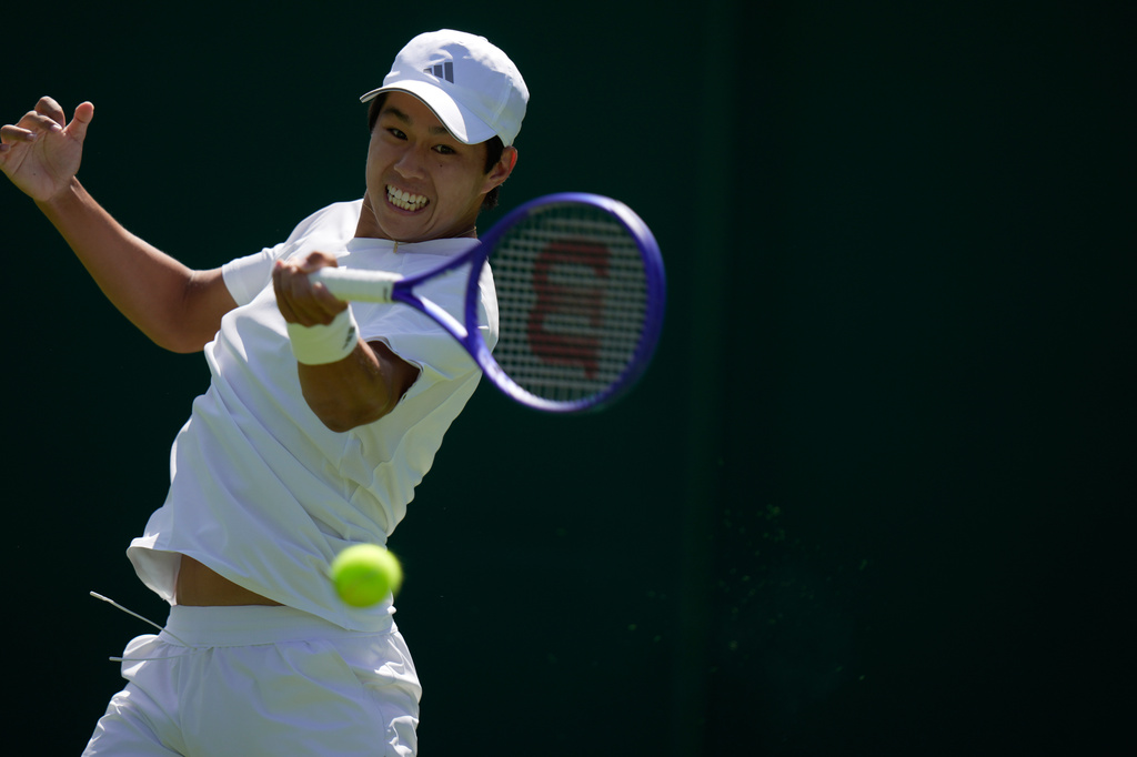 Learner Tien of the United States returns the ball to Dalibor Svrcina of Czech Republic in their first round men's singles match at the Wimbledon Tennis Championships in London, Monday, June 29, 2026. (AP Photo/Brian Inganga)
