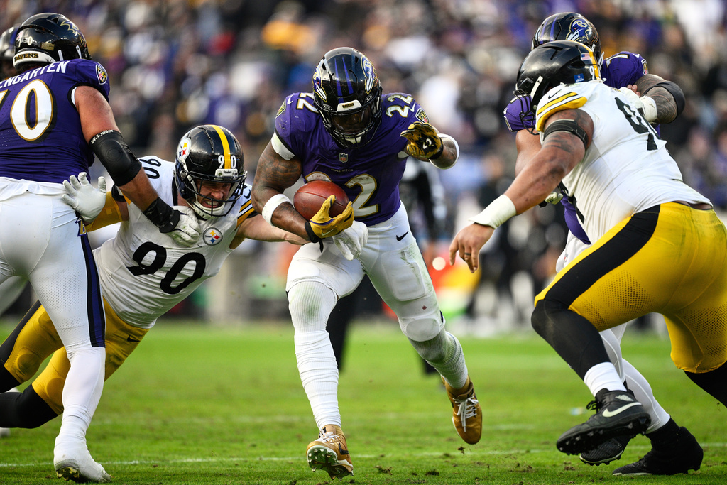 Baltimore Ravens running back Derrick Henry (22) runs the ball during the second half of an NFL football game against the Pittsburgh Steelers, Sunday, Dec. 7, 2025, in Baltimore. (AP Photo/Nick Wass)