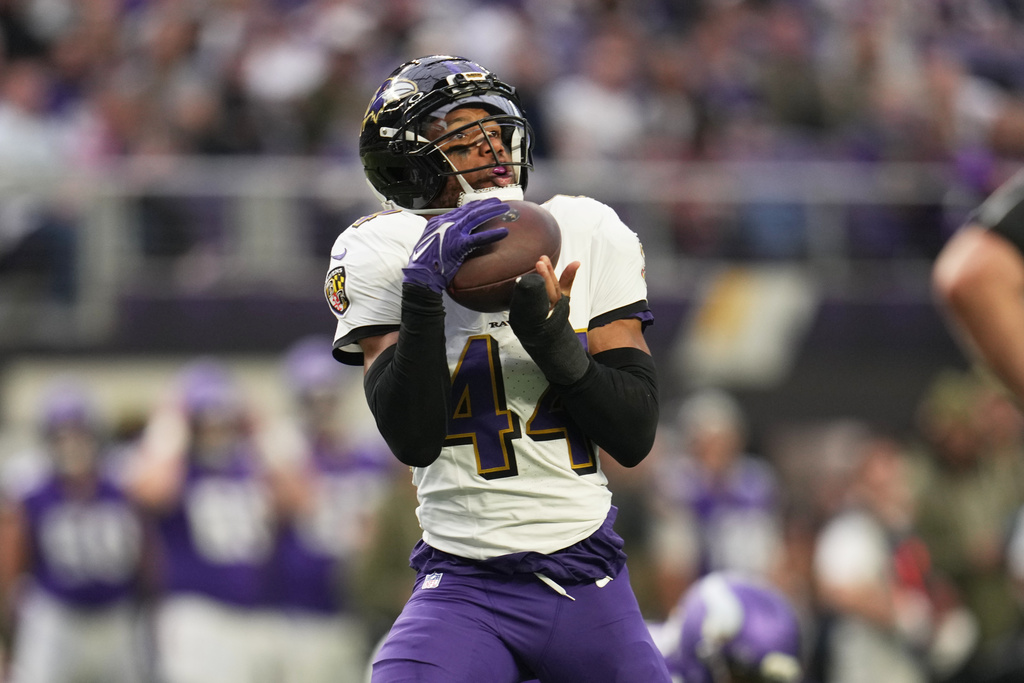 Baltimore Ravens cornerback Marlon Humphrey (44) intercepts a pass against the Minnesota Vikings in the second half of an NFL football game, Sunday, Nov. 9, 2025, in Minneapolis. (AP Photo/Abbie Parr)