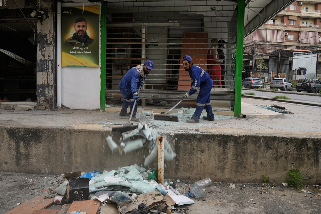 Municipal workers clean the streets in Dahiyeh, Beirut's southern suburbs, Lebanon, Friday, April 17, 2026, following a ceasefire between Israel and Hezbollah. (AP Photo/Bilal Hussein)