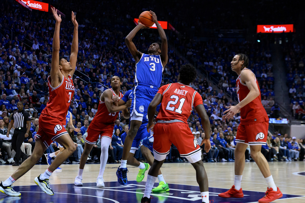 BYU forward AJ Dybantsa (3) shoots during the first half of an NCAA college basketball game against Utah, Saturday, Jan. 24, 2026, in Provo, Utah. (AP Photo/Tyler Tate)