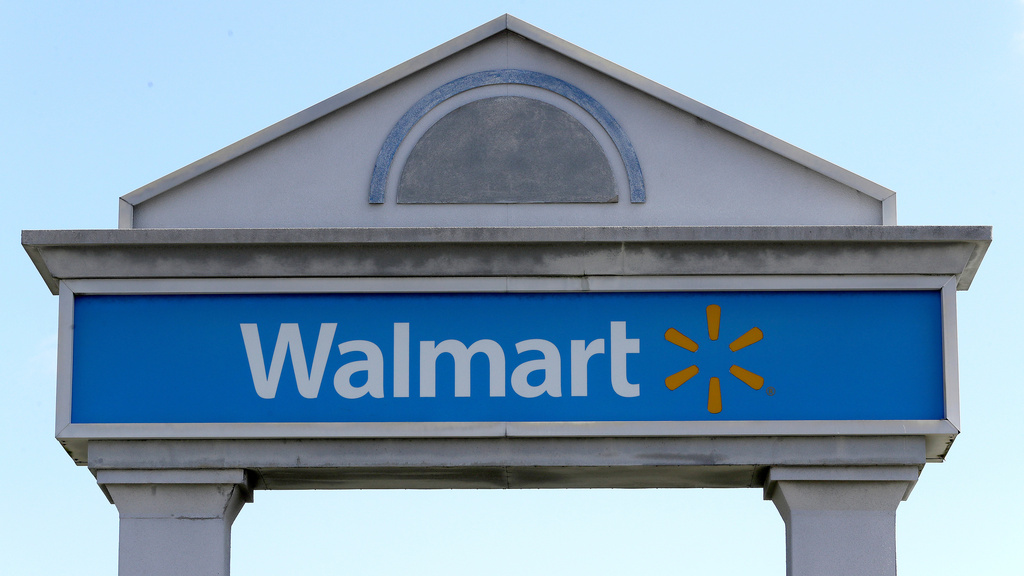 FILE - In this Tuesday, Sept. 3, 2019, file photo, a Walmart logo forms part of a sign outside a Walmart store, in Walpole, Mass. (AP Photo/Steven Senne, File)