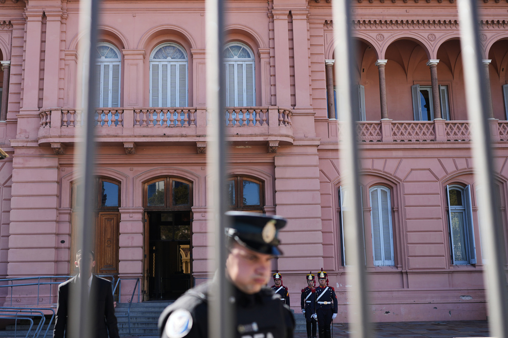 Honor guards stand at attention outside the government house in Buenos Aires, Argentina, Thursday, April 23, 2026. (AP Photo/Rodrigo Abd)