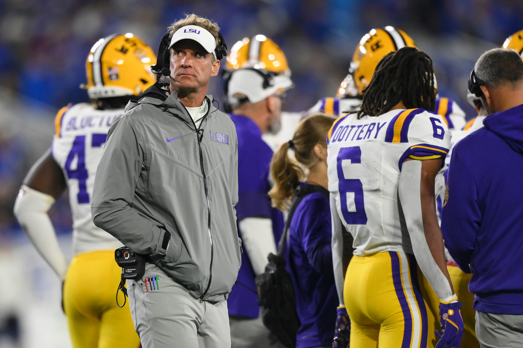 LSU head coach Lane Kiffin, left, looks on during the first half of an NCCA college football game against Kentucky, Saturday, Oct. 10, 2026, in Lexington, Ky. (AP Photo/Tanner Pearson)
