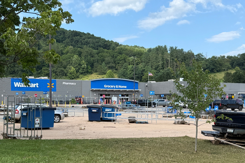 The parking lot of the Walmart in Weston, W.Va., after severe floods on Wednesday, July 22, 2026. (AP Photo/Patrick Aftoora-Orsagos)