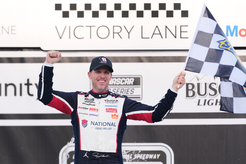 Denny Hamlin celebrates winning a NASCAR Cup Series auto race at Michigan International Speedway in Brooklyn, Mich., Sunday, June 7, 2026. (AP Photo/Paul Sancya)