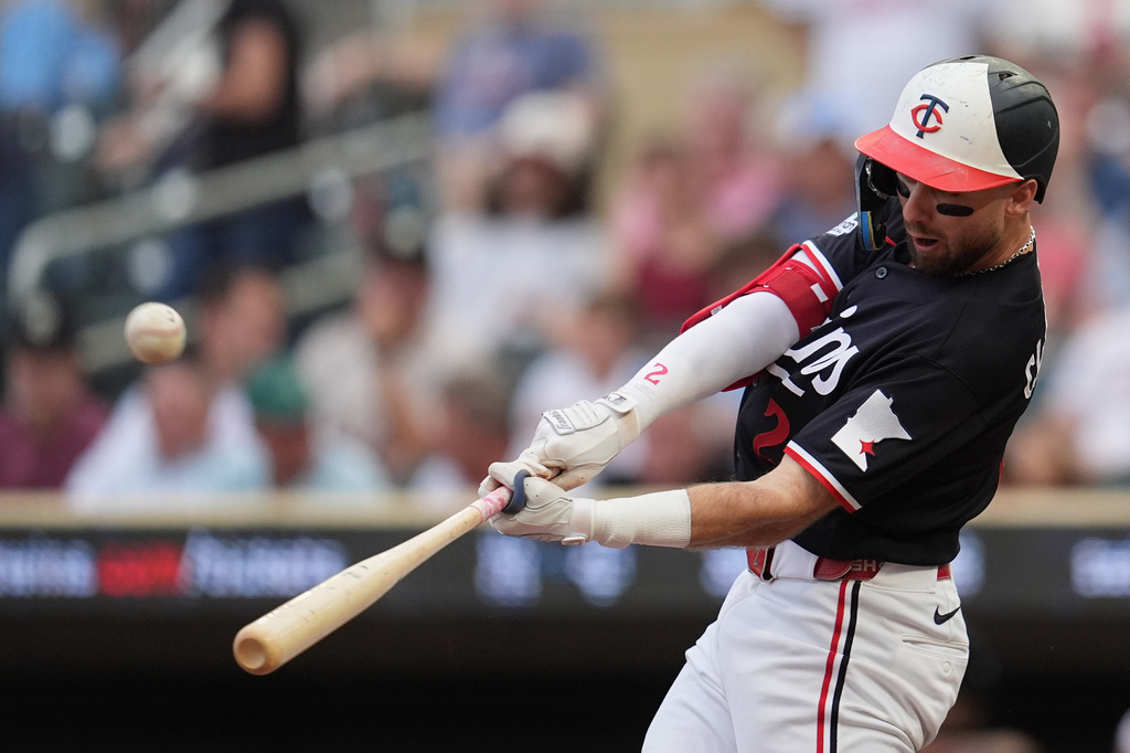 Minnesota Twins' Kody Clemens hits a sacrifice flyout that scored Luke Keaschall during the first inning of a baseball game against the Detroit Tigers, Monday, Aug. 31, 2026, in Minneapolis. (AP Photo/Abbie Parr)