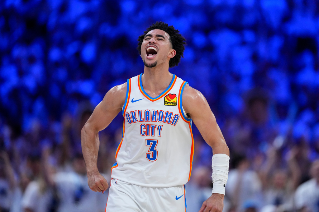 Oklahoma City Thunder guard Jared McCain (3) reacts to a basket against the San Antonio Spurs in the second half of Game 5 in the Western Conference finals NBA basketball playoffs series, Tuesday, May 26, 2026, in Oklahoma City. (AP Photo/Julio Cortez)