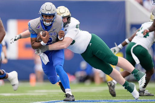 Memphis quarterback Brendon Lewis, left, is tackled by South Florida defensive tackle Jacob Merrifield (40) during the first half of an NCAA college football game Saturday, Oct. 25, 2025, in Memphis, Tenn. (AP Photo/George Walker IV) Memphis quarterback Brendon Lewis, left, is tackled by South Florida defensive tackle Jacob Merrifield (40) during the first half of an NCAA college football game Saturday, Oct. 25, 2025, in Memphis, Tenn. (AP Photo/George Walker IV)
