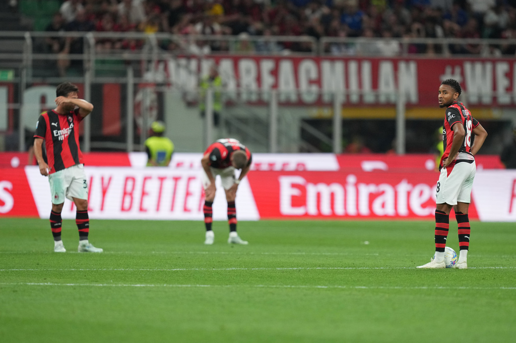 AC Milan's Christopher Nkunku, right, reacts with his teammates after Cagliari's Juan Rodriguez scored his side's second goal during the Serie A soccer match between AC Milan and Cagliari, in Milan, Italy, Sunday, May 24, 2026. (AP Photo/Antonio Calanni)
