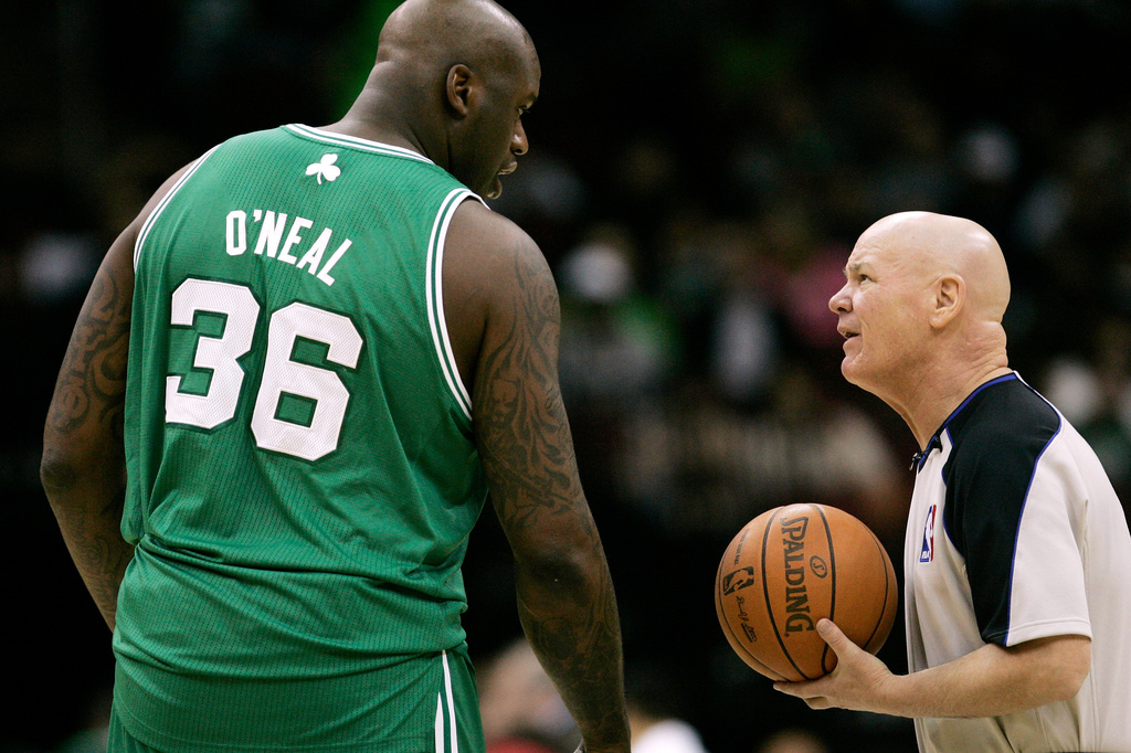 FILE - Boston Celtics' Shaquille O'Neal (36) talks with referee Joey Crawford before the start of an NBA basketball game against the New Jersey Nets at the Prudential Center in Newark, N.J., Dec. 5, 2010. (AP Photo/Rich Schultz, File)