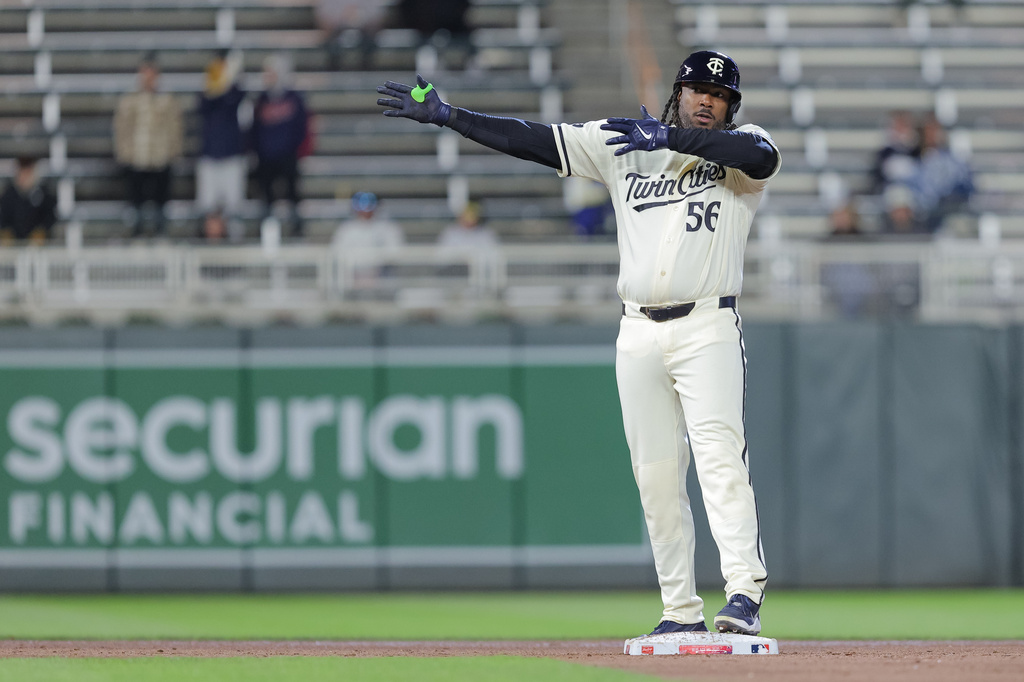 Minnesota Twins designated hitter Josh Bell celebrates hitting an RBI-double during the fifth inning of a baseball game against the Detroit Tigers, Tuesday, April 7, 2026, in Minneapolis. (AP Photo/Bailey Hillesheim)