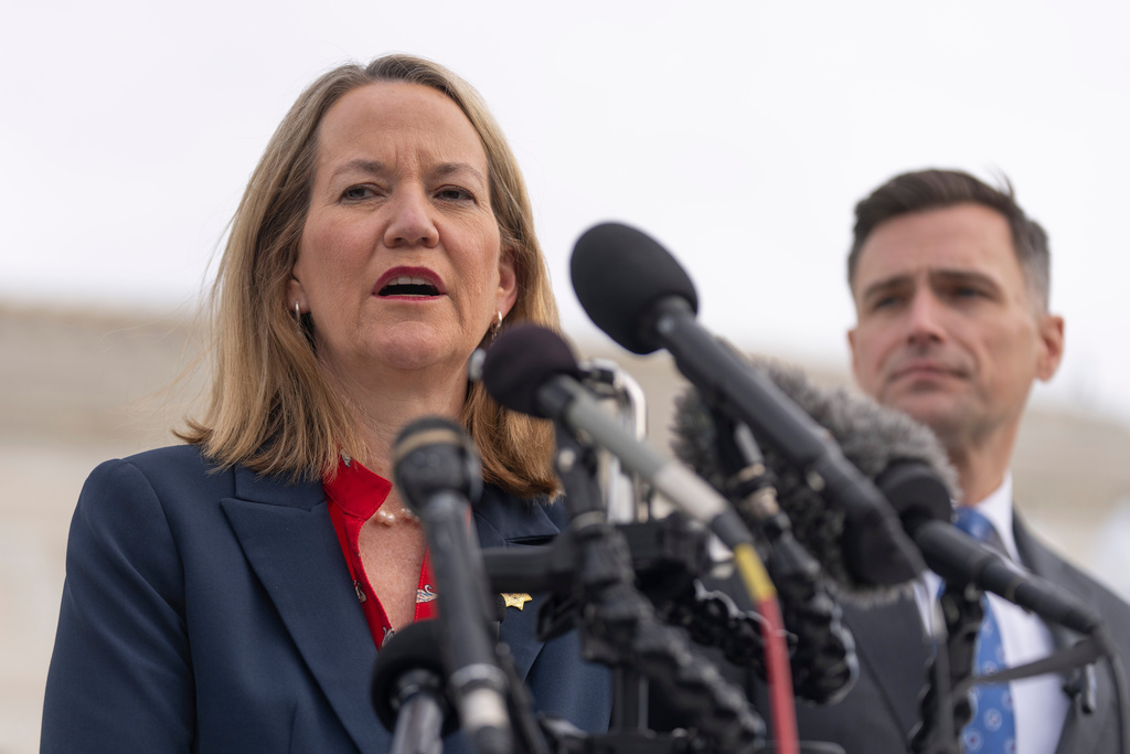 FILE - Arizona Attorney General Kris Mayes speaks to reporters as Oregon Attorney General Dan Rayfield listens outside the Supreme Court, Nov. 5, 2025, in Washington. (AP Photo/Mark Schiefelbein, File)