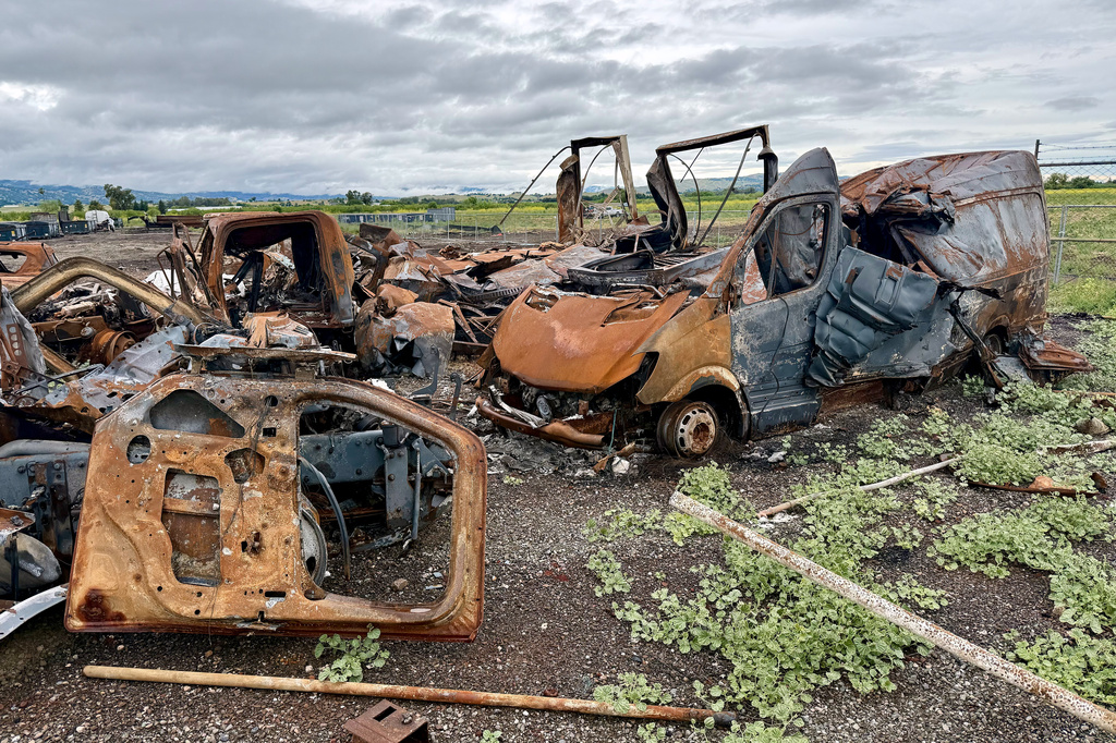 Damaged vehicles are shown at the location of a July 1, 2025, fireworks explosion in Esparto, Calif., Friday, April 10, 2026. (AP Photo/Haven Daley)