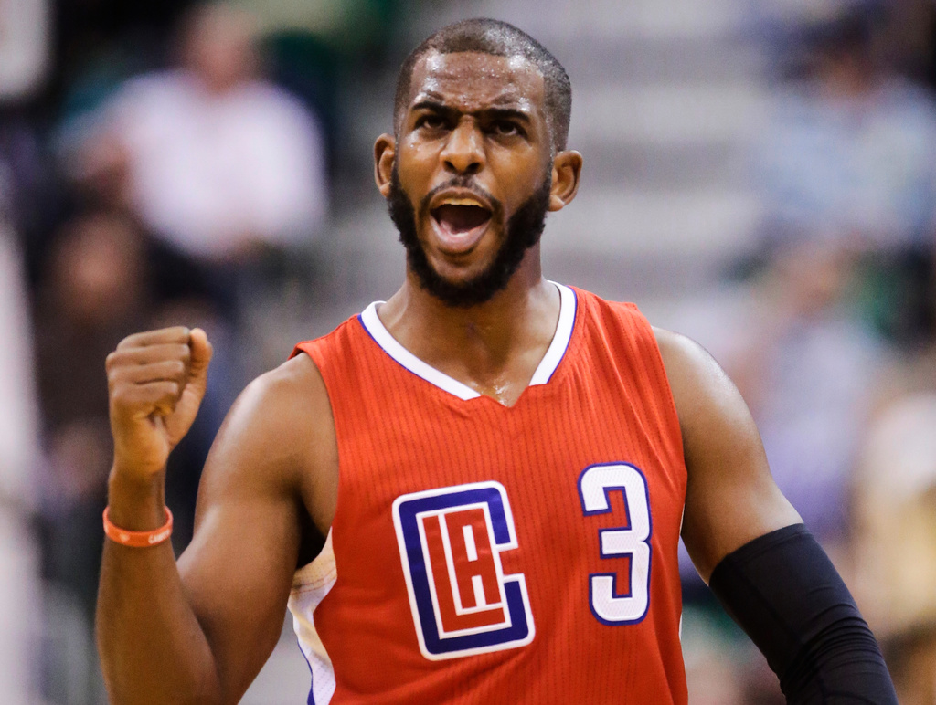 FILE - Los Angeles Clippers guard Chris Paul celebrates after a score during the second half of an NBA basketball game against the Utah Jazz Saturday, Dec. 26, 2015, in Salt Lake City. (AP Photo/Rick Bowmer, File)