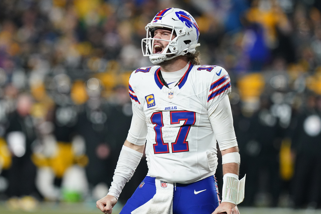 Buffalo Bills quarterback Josh Allen (17) celebrates after a touchdown during the second half of an NFL football game against the Pittsburgh Steelers Sunday, Nov. 30, 2025, in Pittsburgh. (AP Photo/Matt Freed)