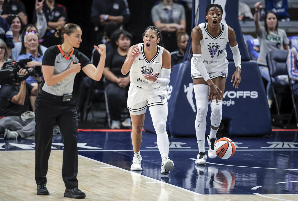 Veronica Burton (22) and Temi Fágbénlé (14) react to a call against the Valkyries in the first half as the Golden State Valkyries played the Minnesota Lynx in Game 1 of the WNBA first round playoffs at Target Center in Minneapolis, Minn., on Sunday, Sept. 14, 2025. (Carlos Avila Gonzalez/San Francisco Chronicle via AP)
