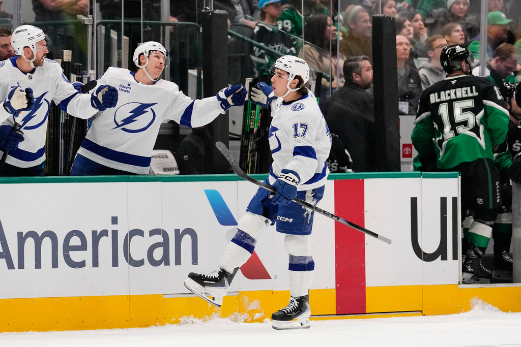Tampa Bay Lightning center Dominic James (17) celebrates with the bench after scoring in the first period of an NHL hockey game against the Dallas Stars in Dallas, Sunday, Jan. 18, 2026. (AP Photo/Tony Gutierrez)