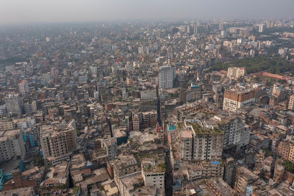 A general aerial view of an old city where roofs and walls collapsed after an earthquake in Dhaka, Bangladesh, Friday, Nov. 21, 2025. (AP Photo/Abdul Goni)