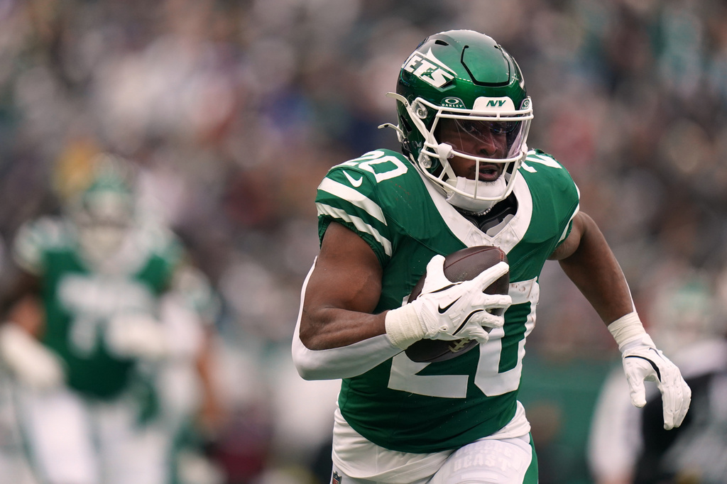 FILE - New York Jets running back Breece Hall (20) carries the ball during an NFL football game against the New England Patriots, Dec. 28, 2025, in New York. (AP Photo/Vera Nieuwenhuis, File)