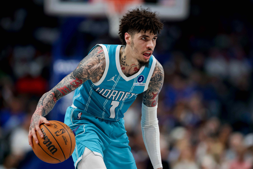 Charlotte Hornets guard Lamelo Ball looks to the basket during the second half of an NBA basketball preseason game against the Dallas Mavericks in Dallas, Saturday, Oct. 11, 2025. (AP Photo/Gareth Patterson)