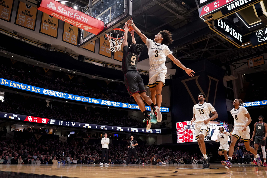 Vanderbilt guard Tyler Tanner (3) attempts to block Oklahoma guard Nijel Pack (9) dunk during the first half of an NCAA college basketball game Saturday, Feb. 7, 2026, in Nashville, Tenn. (AP Photo/Camden Hall)
