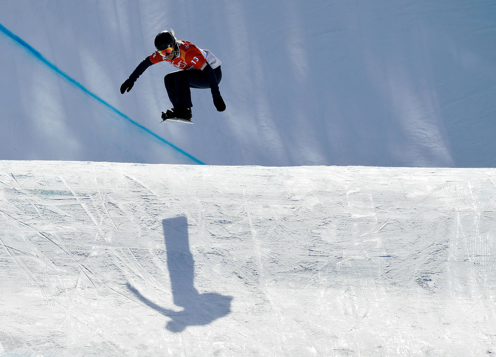 FILE - Lindsey Jacobellis, of the United States, jumps during the women's snowboard cross qualifying run at Phoenix Snow Park at the 2018 Winter Olympics in Pyeongchang, South Korea, Feb. 16, 2018. (AP Photo/Kin Cheung, File)