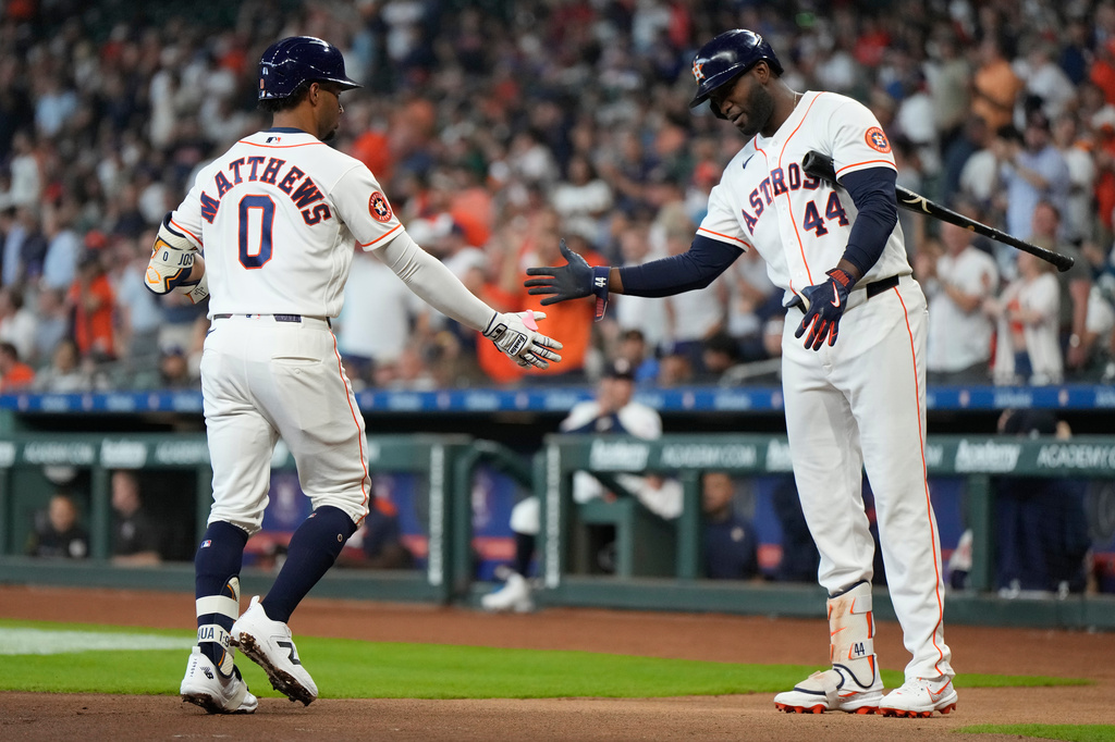 Houston Astros' Brice Matthews (0) celebrates with designated hitter Yordan Alvarez (44) after hitting a home run during the first inning of a baseball game against the Los Angeles Dodgers in Houston, Wednesday, May 6, 2026. (AP Photo/Ashley Landis)