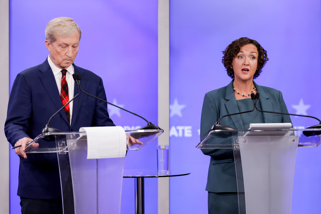 Tom Steyer, left, and Katie Porter, candidates in California's gubernatorial race, take part in a gubernatorial debate hosted by Nexstar Wednesday, April 22, 2026, in San Francisco. (Jason Henry/Pool Photo via AP)