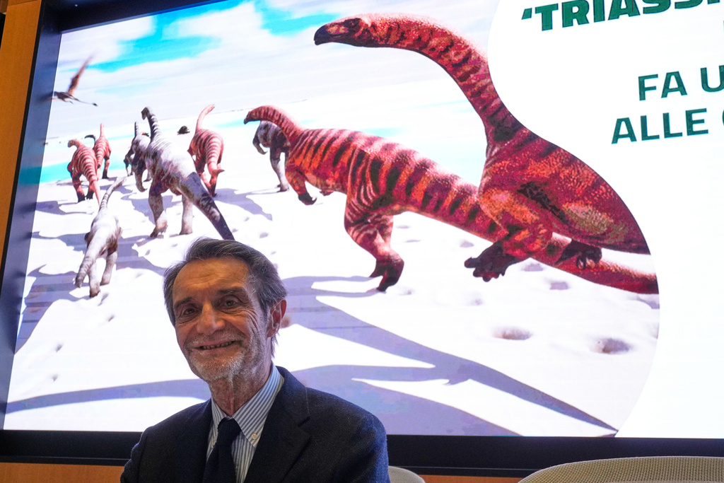 Lombardy Region president Attilio Fontana attends a press conference in Milan, Italy, Tuesday, Dec. 16, 2025, on a discovery of thousands of dinosaur tracks in Lombardy region. (AP Photo/Luca Bruno)