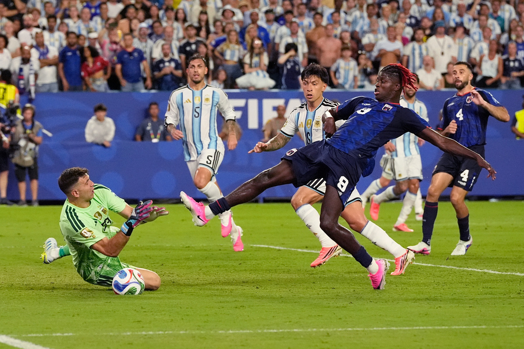 Cape Verde's Gilson Benchimol (9) takes a shot against Argentina goalkeeper Emiliano Martinez (23) during the World Cup round of 32 soccer match between Argentina and Cape Verde in Miami Gardens, Fla., Friday, July 3, 2026. (AP Photo/George Walker IV)