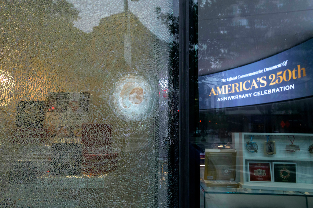 Bullet holes and shattered glass remain at The People's House, Sunday, May 24, 2026, in Washington after the U.S. Secret Service shot a person near the White House on Saturday. (AP Photo/Rod Lamkey, Jr.)
