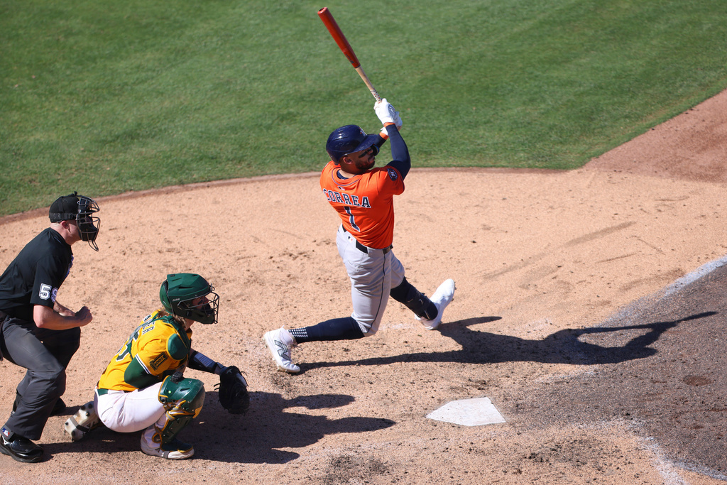 Houston Astros' Carlos Correa hits an RBI double during the seventh inning of a baseball game against the Athletics, Thursday, Sept. 25, 2025, in West Sacramento, Calif. (AP Photo/Scott Marshall)