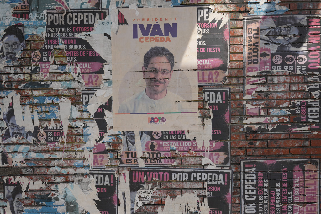 A campaign poster of presidential candidate Iván Cepeda covers a wall in downtown Barranquilla, Colombia, Monday, June 22, 2026, the day after the presidential election runoff. (AP Photo/Rodrigo Abd)