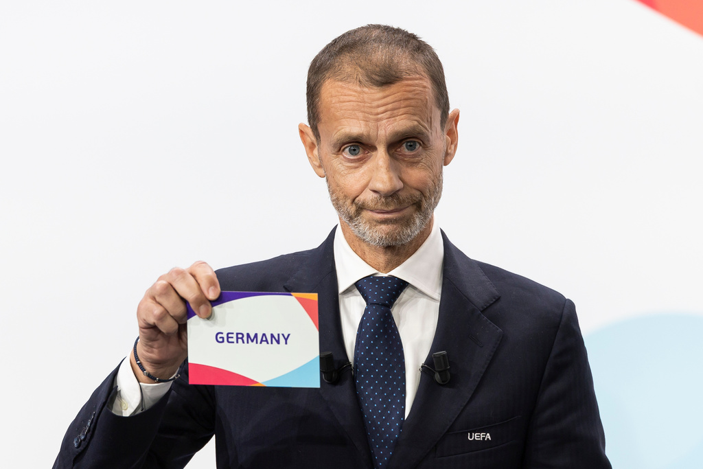 UEFA president Aleksander Ceferin shows the name of Germany, during the the announcement ceremony for the host country of the UEFA Women's EURO 2029, in Nyon, Switzerland, Wednesday, Dec. 3, 2025. (Cyril Zingaro/Keystone via AP)