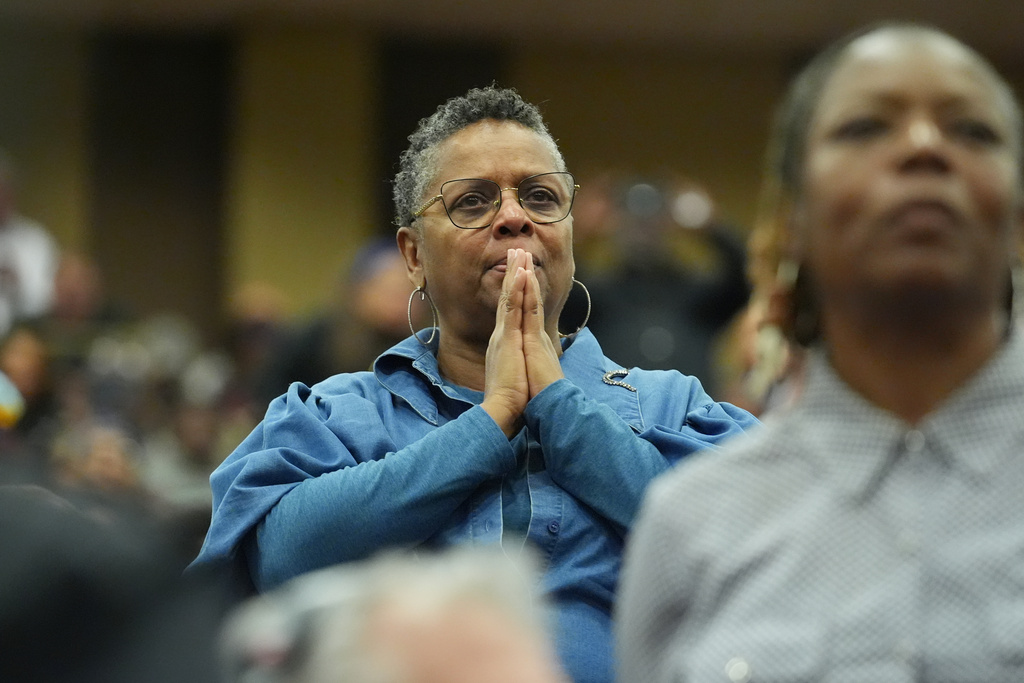 A person stands during the Public Homegoing Service for the Rev. Jesse Jackson at the House of Hope in Chicago, Friday, March 6, 2026. (AP Photo/Nam Y. Huh)
